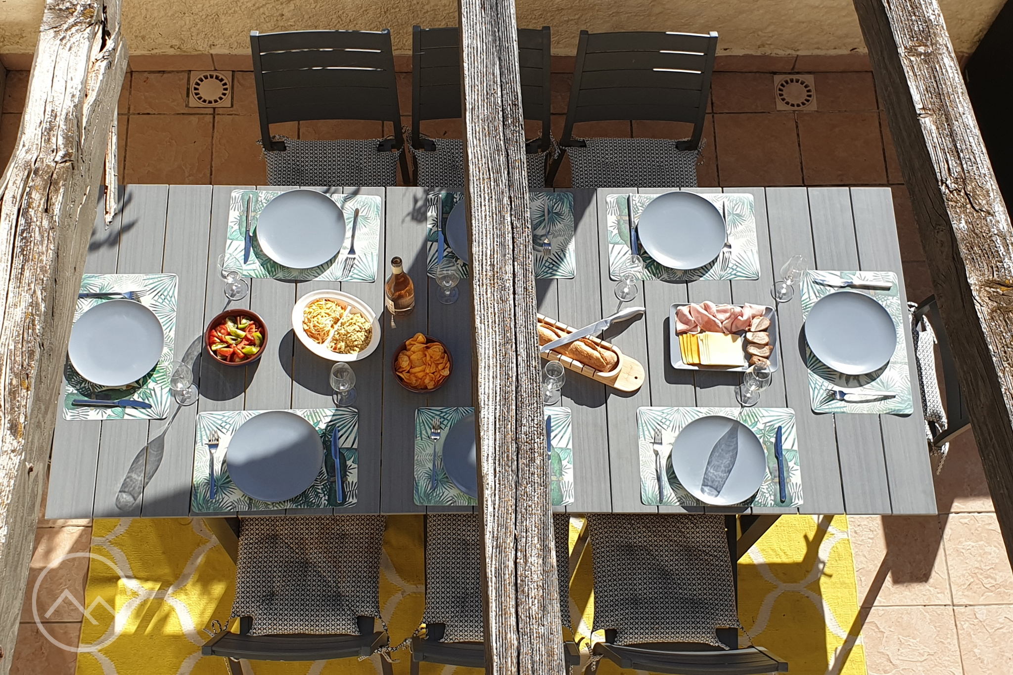 Aerial shot of lunch on the balcony at Chez Montagnes vacation rental